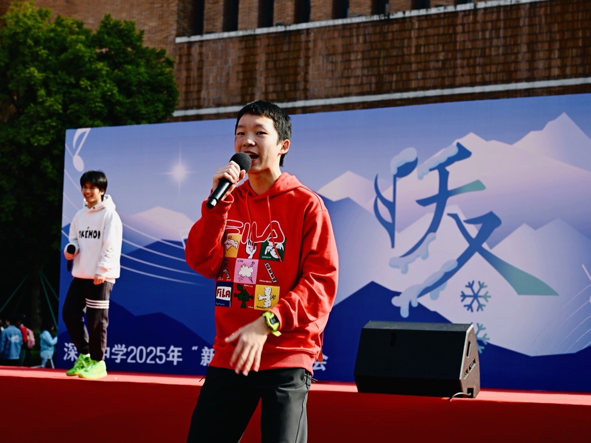 Ben performing hip-hop on an outdoor stage